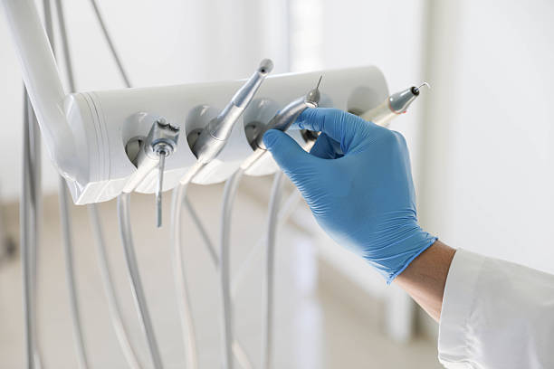 Professional Tooth Extraction technician working in College Park, MD